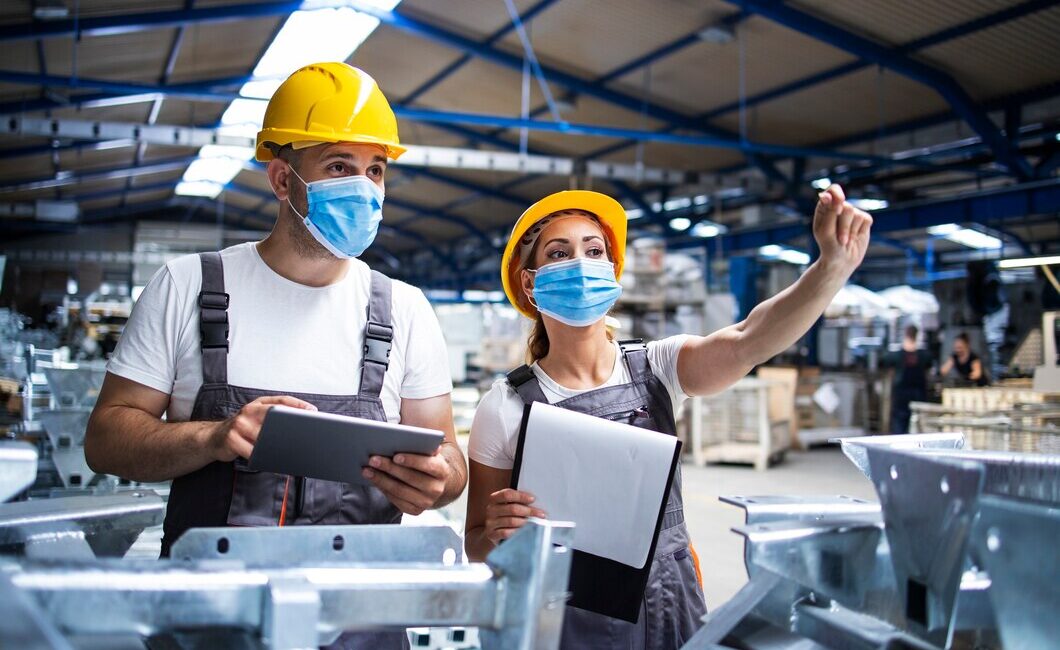 factory-workers-with-face-masks-protected-against-corona-virus-doing-quality-control-production-factory_342744-96